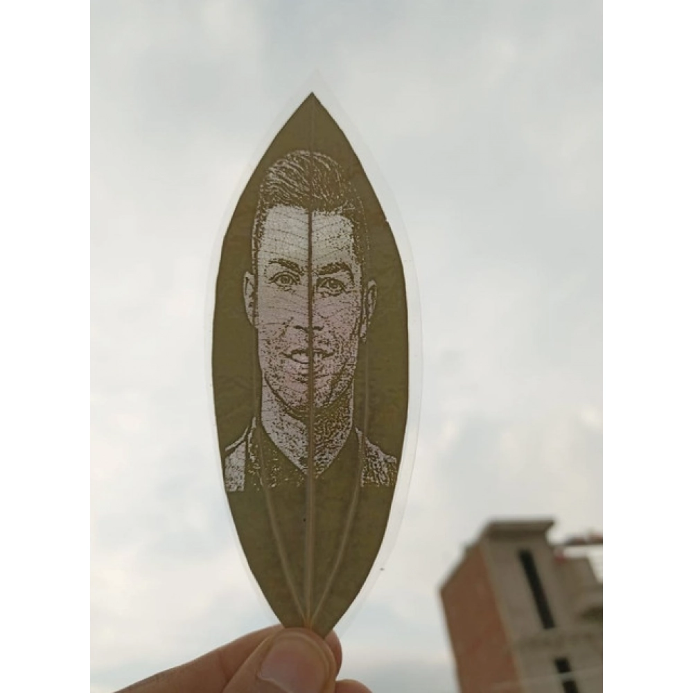 Custom Engraved Leaf Art – Football Icon Portrait on Natural Lea